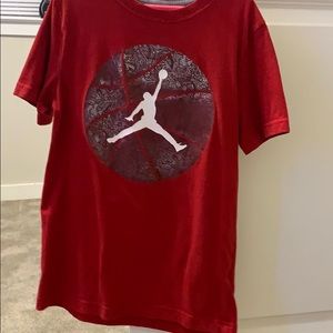 A red Jordan shirt